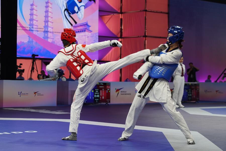 지난 8월 29일 한국과 중국 선수가 '2026 세계태권도연맹(WT) 여자오픈챔피언십'에서 맞붙고 있다. (사진/신화통신)